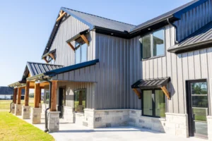 Modern house with metal siding and windows.