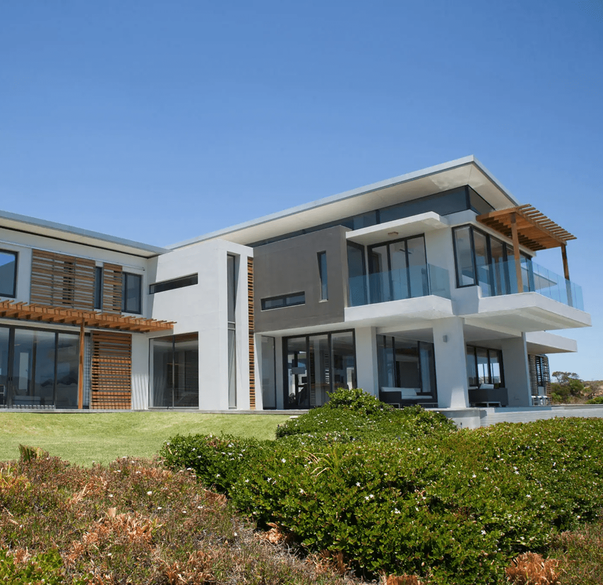 Modern house with large glass windows.