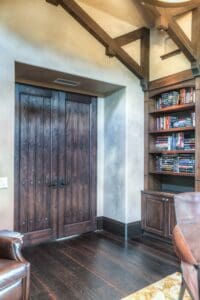Wooden doors and bookshelf in study