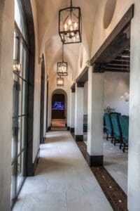 Elegant arched hallway with chandeliers