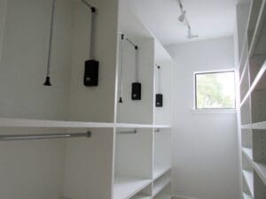 Spacious closet interior with hanging rods