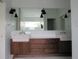 Contemporary bathroom vanity with wooden cabinets.
