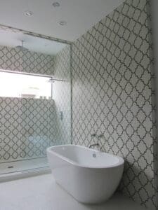 White bathtub in tiled bathroom