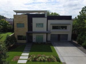 Contemporary home with large driveway and garden.
