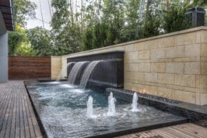 Elegant water feature with stone wall