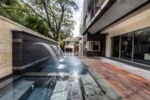 Luxury outdoor pool with waterfall feature