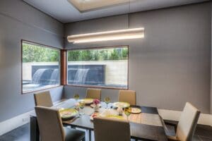 Elegant dining setup with large windows