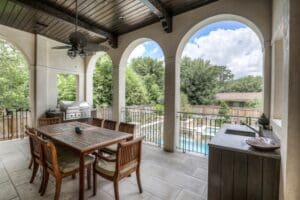 Covered patio overlooking backyard pool