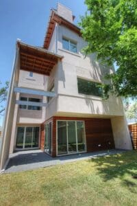 Contemporary home with lush green lawn