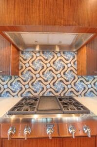 Contemporary kitchen design with geometric backsplash