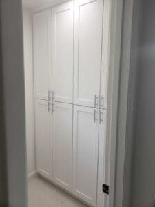 Modern white pantry cabinets in small space
