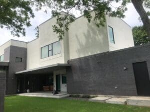 Modern two-story house with large windows