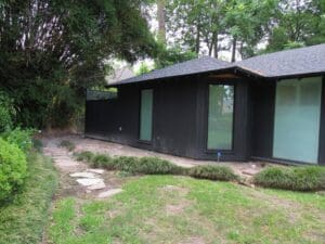Single-story home in wooded area