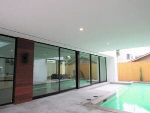 Modern patio with pool and glass doors